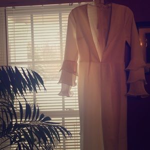 White Deep-V jumpsuit with ruffled sleeves